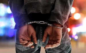 Man in handcuffs, how to beat a simple assault charge in Texas