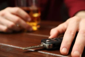 Drunk man reaching for his car keys