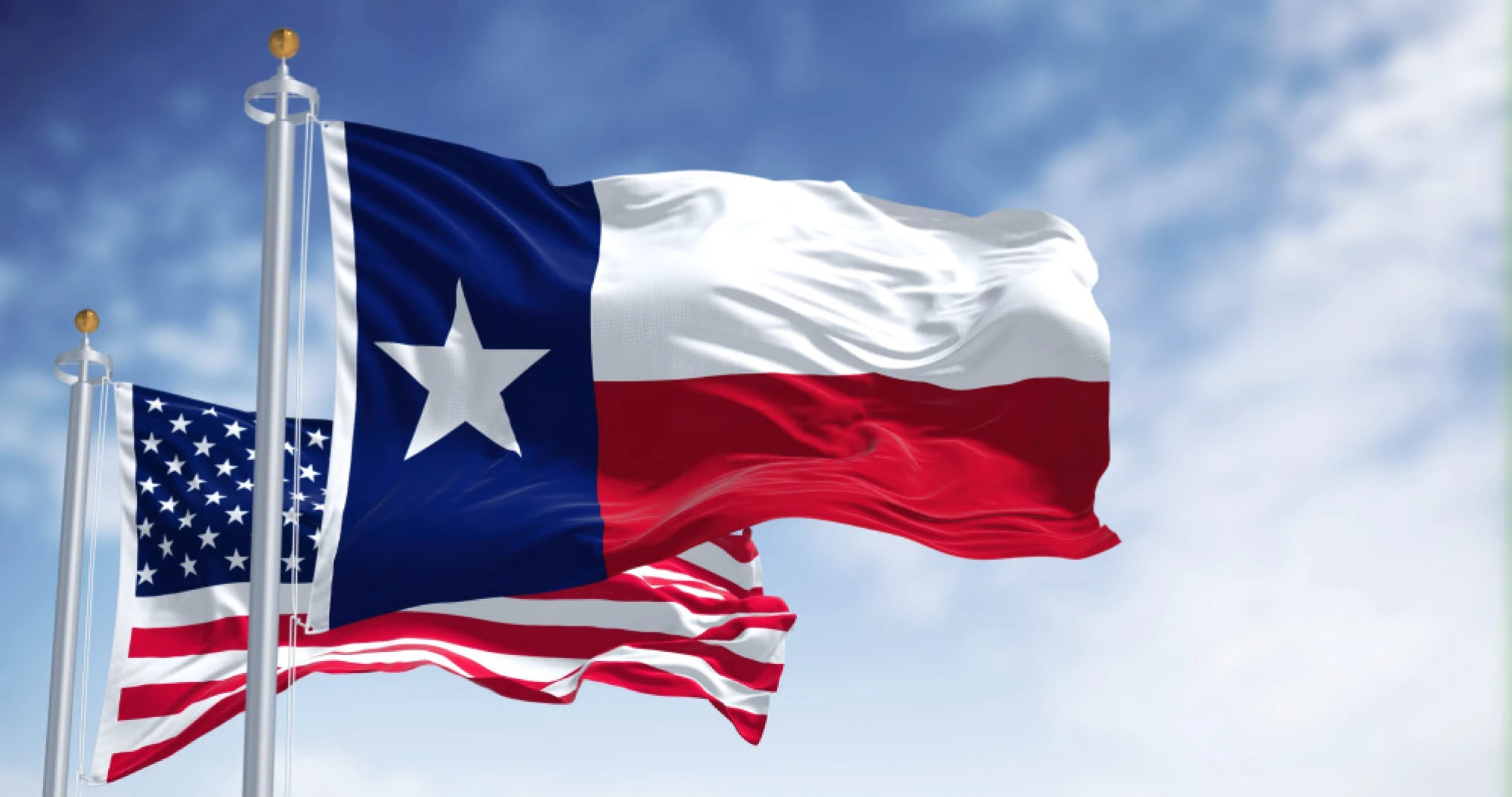 The Texas State flag and the United States flag