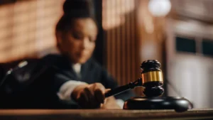 A judge declaring a sentence with her gavel