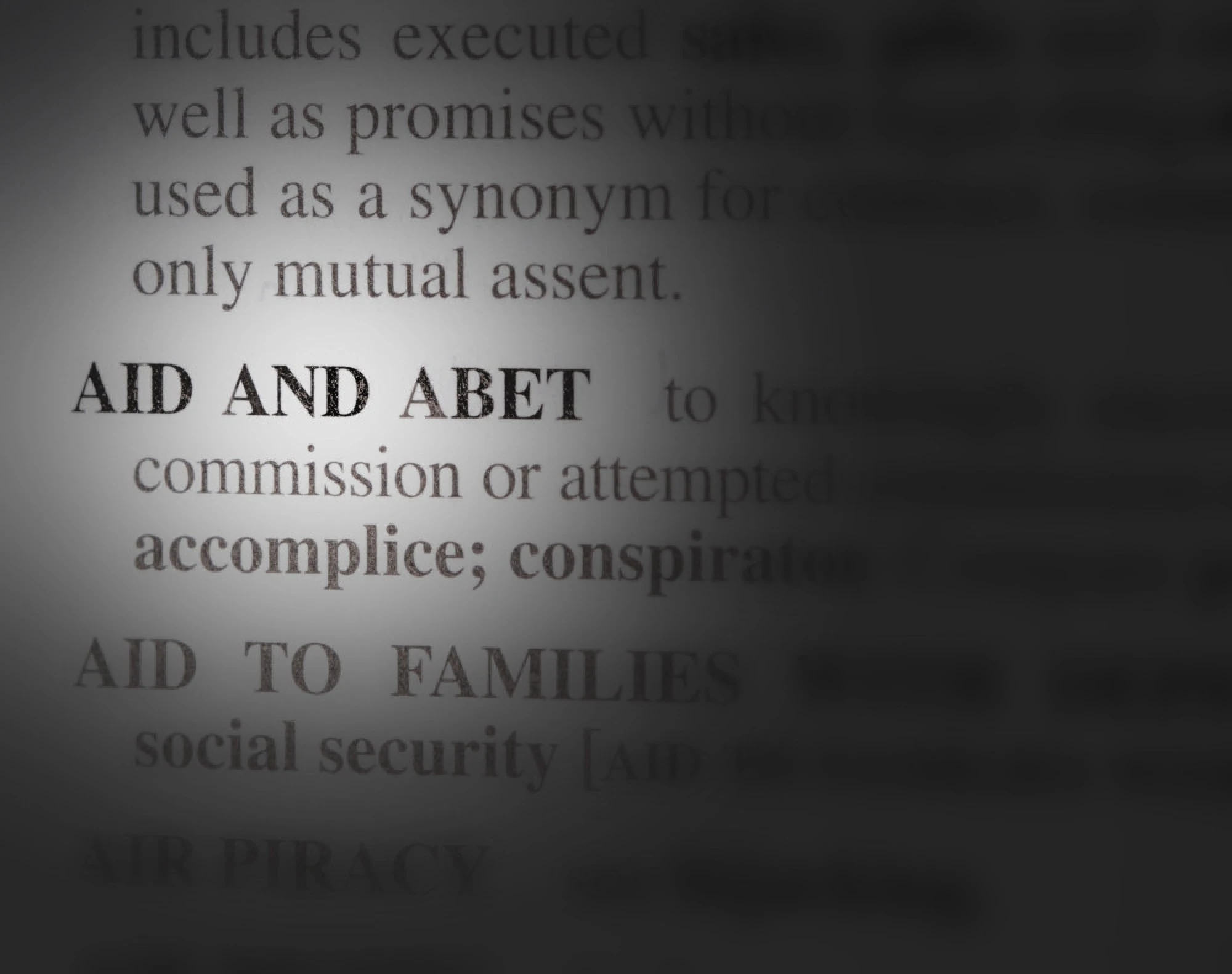 close of view of the dictionary definition of aid and abet