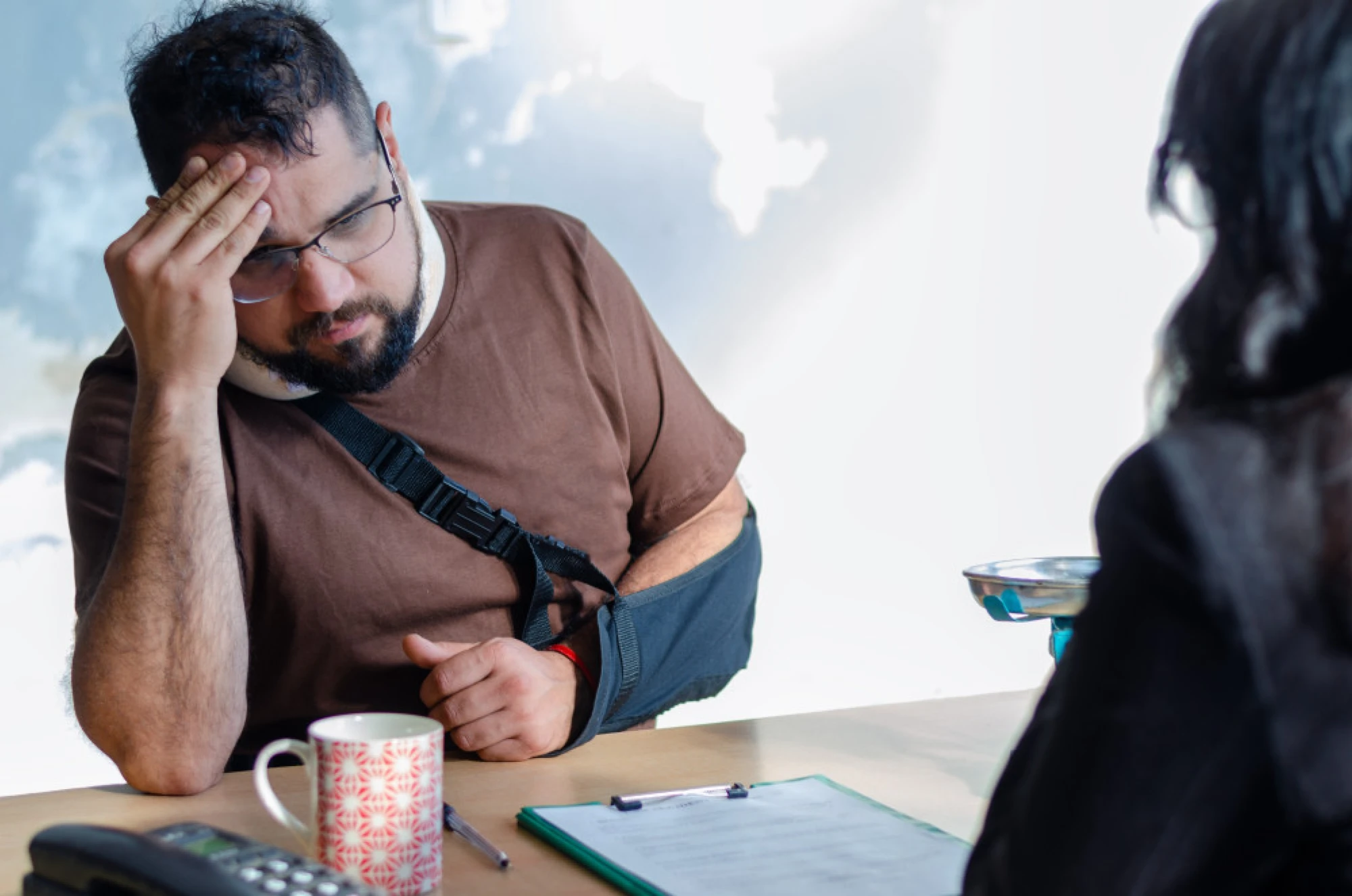 A critically injured man meeting with an attorney