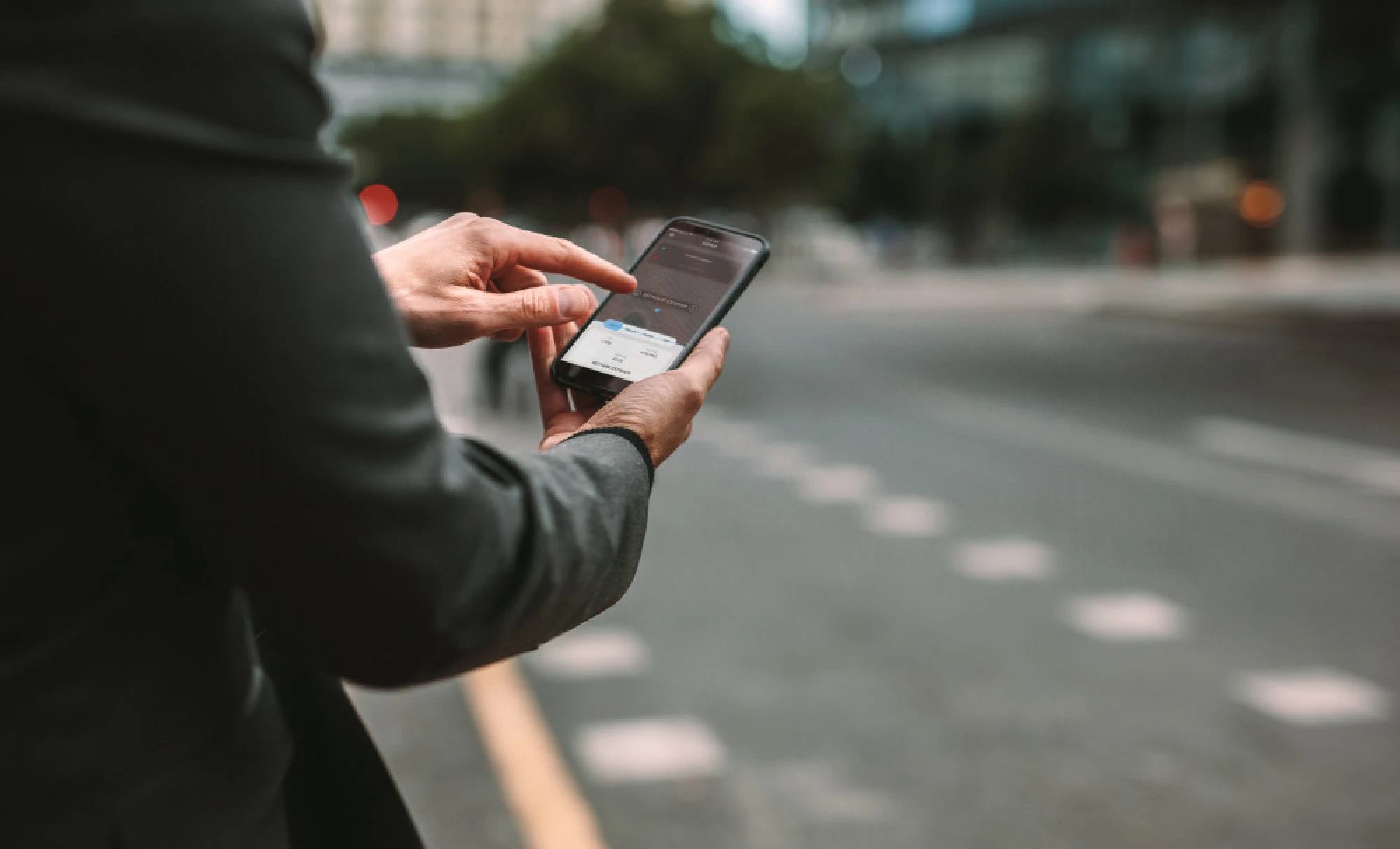 a woman checking her rideshare app
