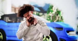 A motorist experiencing whiplash symptoms after an accident