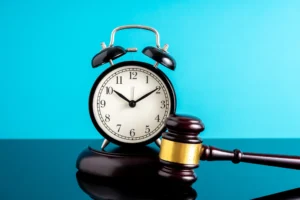 A judge’s gavel and an alarm clock symbolizing the statute of limitations