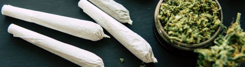 Marijuana joints on a table.