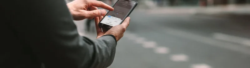 a woman checking her rideshare app