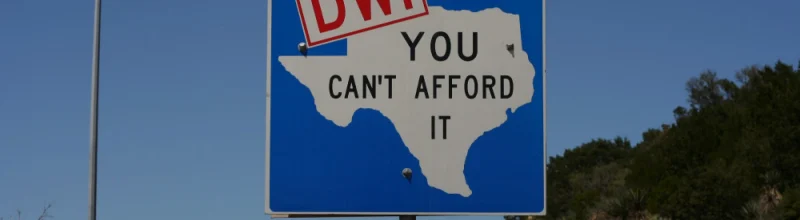 A street sign with an outline of the state of Texas and the words, “DWI, you can’t afford it.”