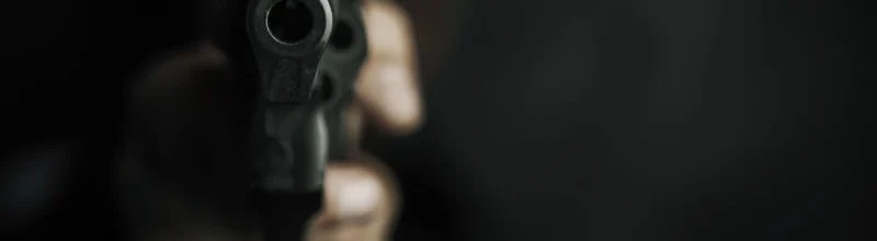 Man pointing a gun