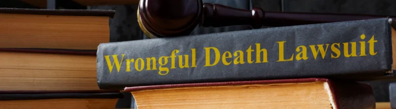 A stack of legal books labeled “wrongful death lawsuit”
